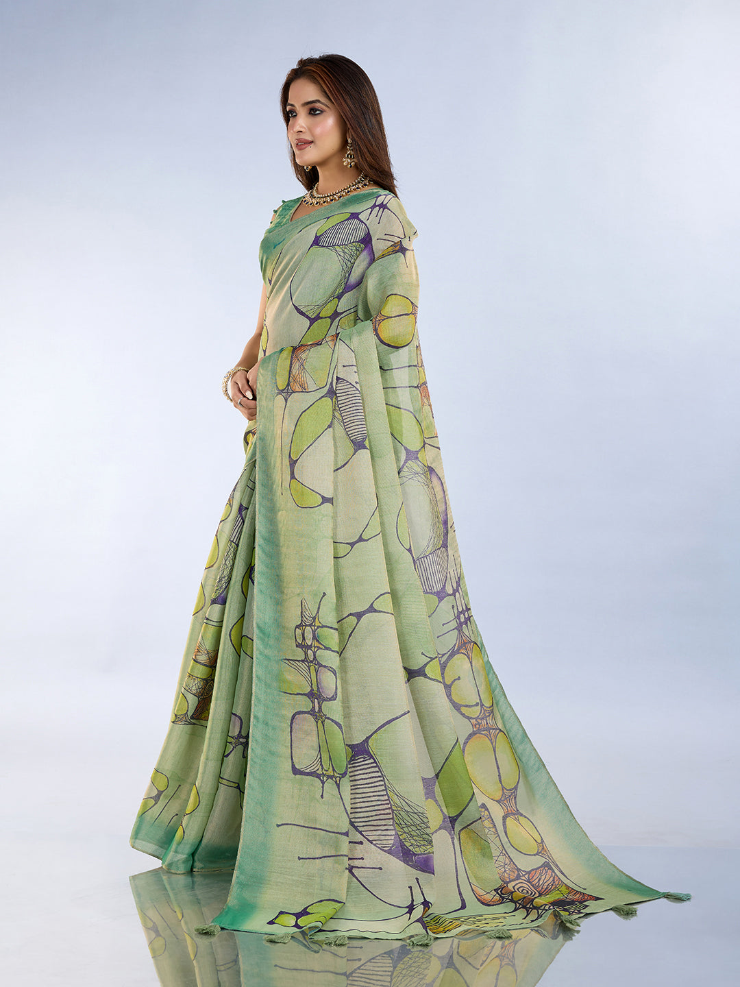 Sea Green Linen Cotton Saree with Tassel Pallu worn elegantly, showcasing a blend of traditional and modern fashion.