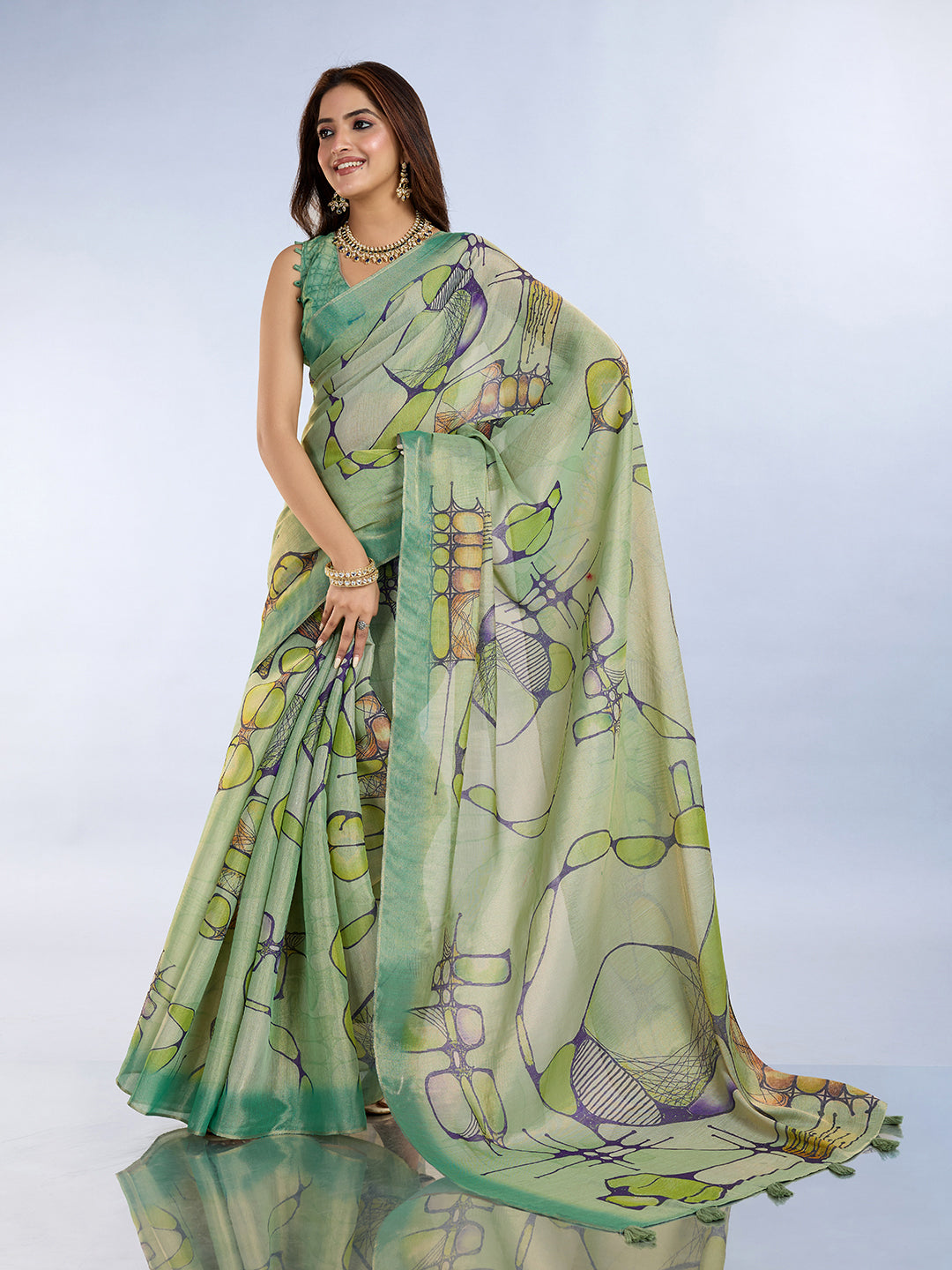 Woman wearing a Sea Green Linen Cotton Saree with Tassel Pallu, showcasing elegant ethnic fashion.